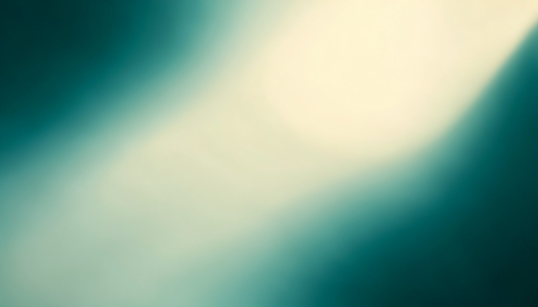 Soft teal and warm cream gradient with gentle blurred light, evoking an evening studio atmosphere